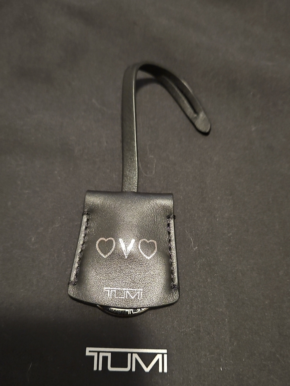 Tumi Black Leather Bag Hook with Heart Accents